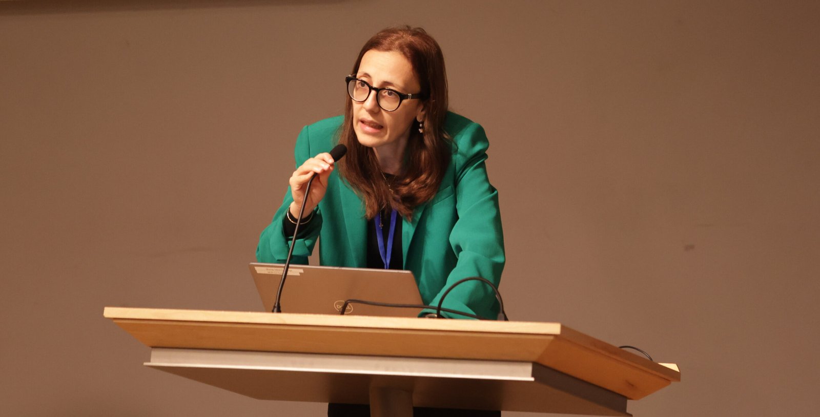 A speaker at a EuroMid academic conference